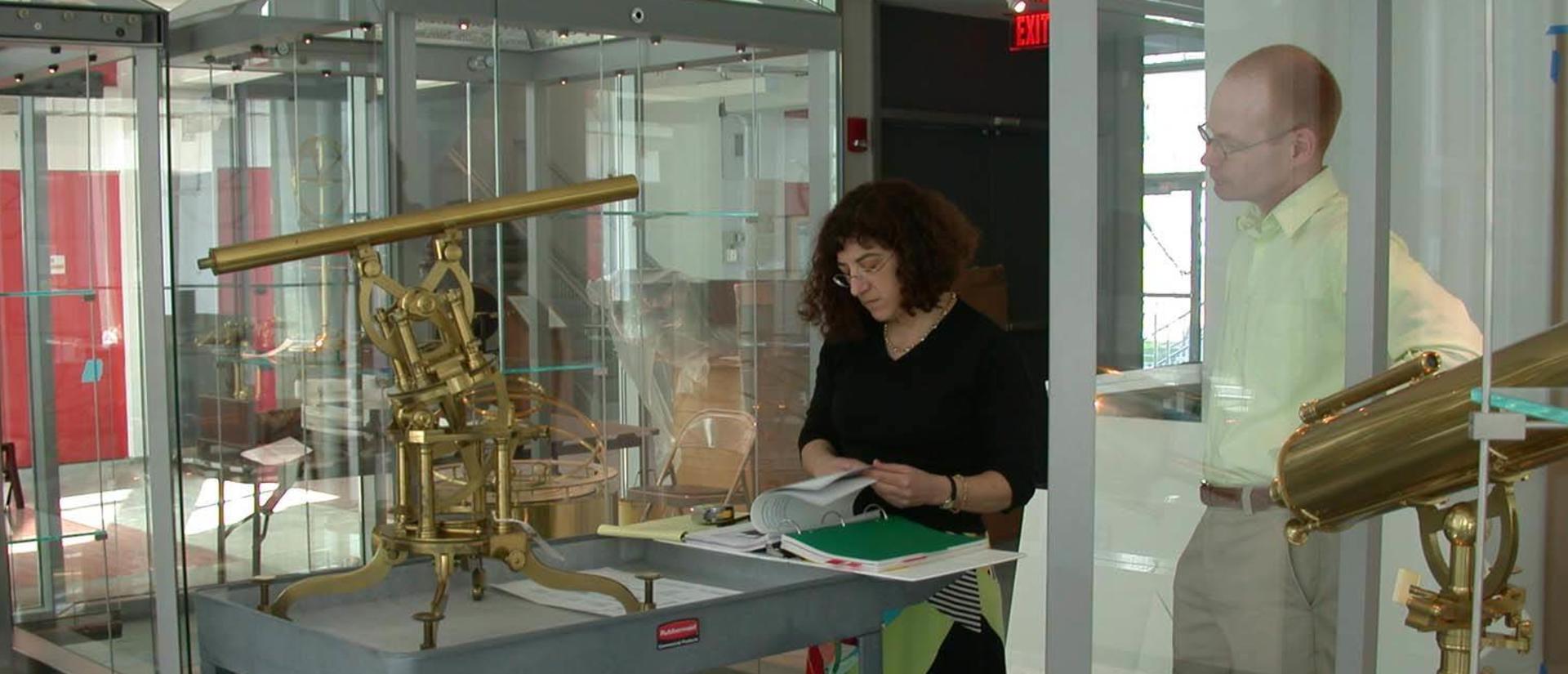Sara Schechner and Michael Kelley installing exhibition in Putnam Gallery